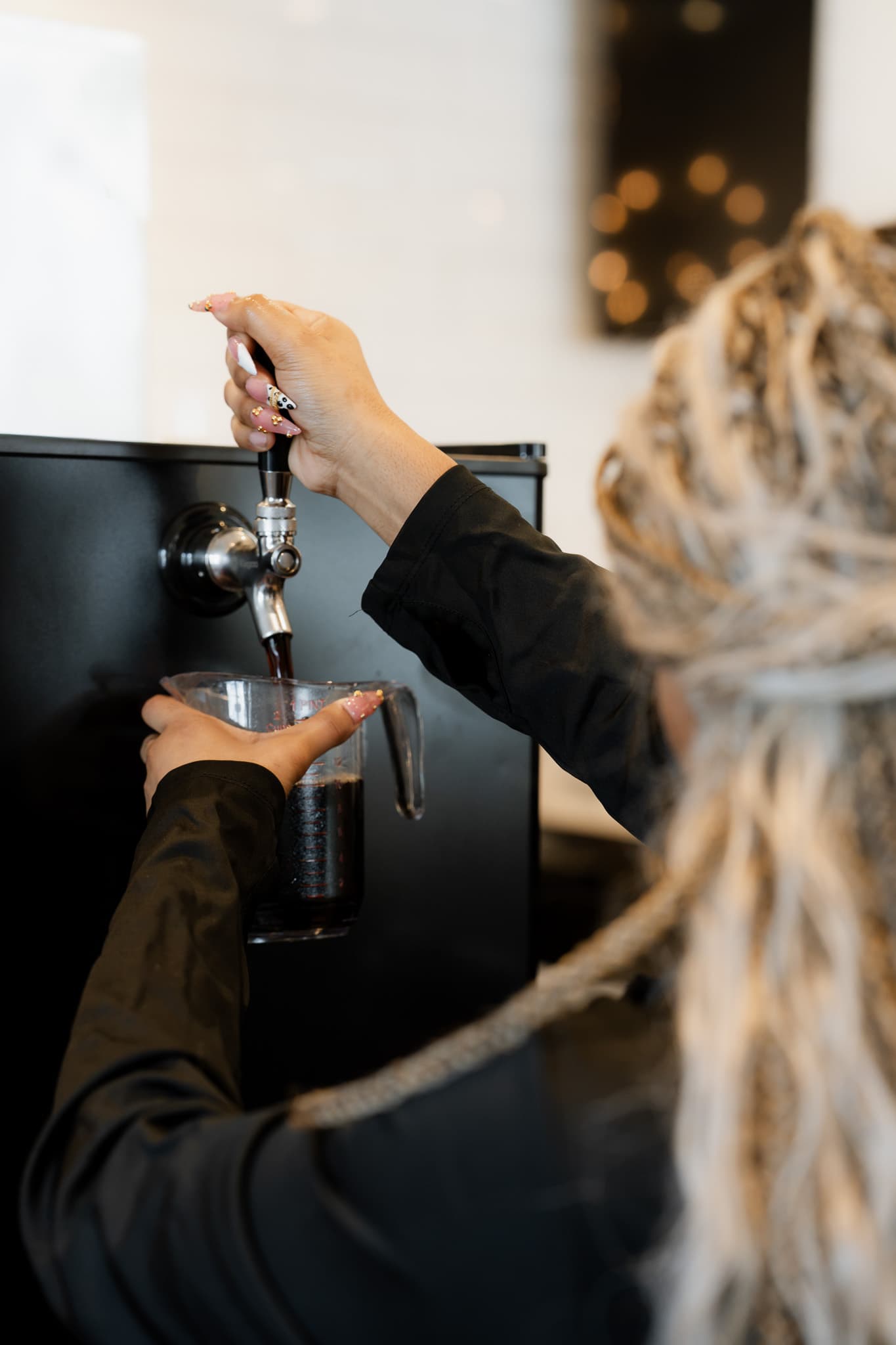 Cold brew being poured from the tap